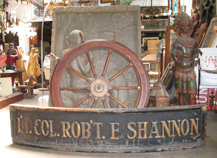 Ship's wheel, cigar store Indian
