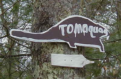 Beaver shaped sign that says Tomaquag, 2006