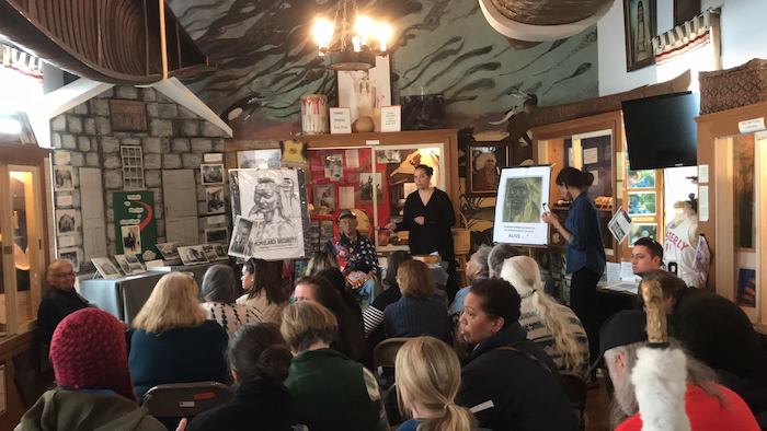 Crowd takes in presentation at the Museum, 2017