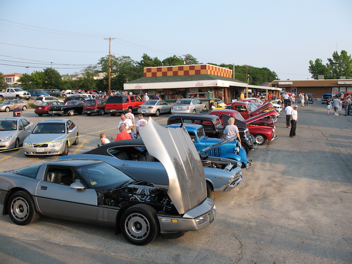A&W parking lot with several antique cars